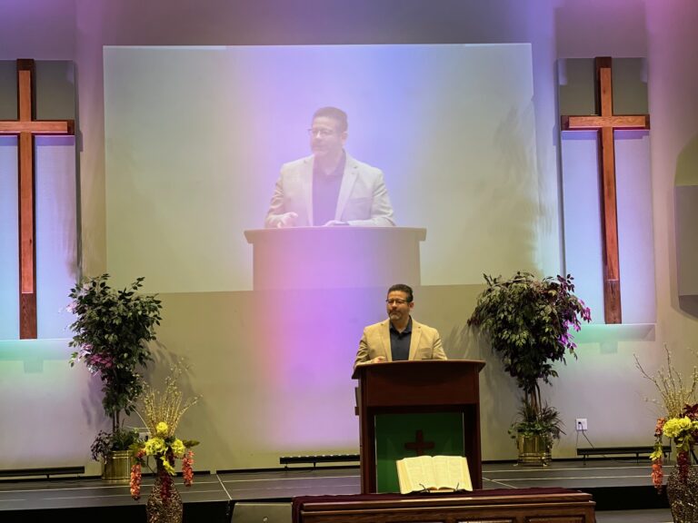 Pastor Juan preaching at Esperanza Viva